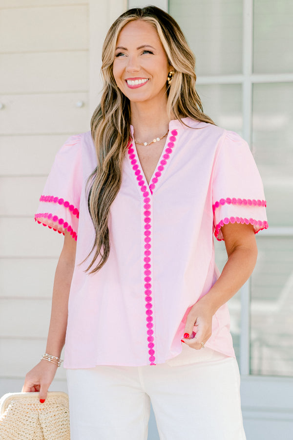 Chic Soul Plus size clothing, pink short sleeve top that has a v-neckline and polka detailing on the sleeves and throughout the neckline 