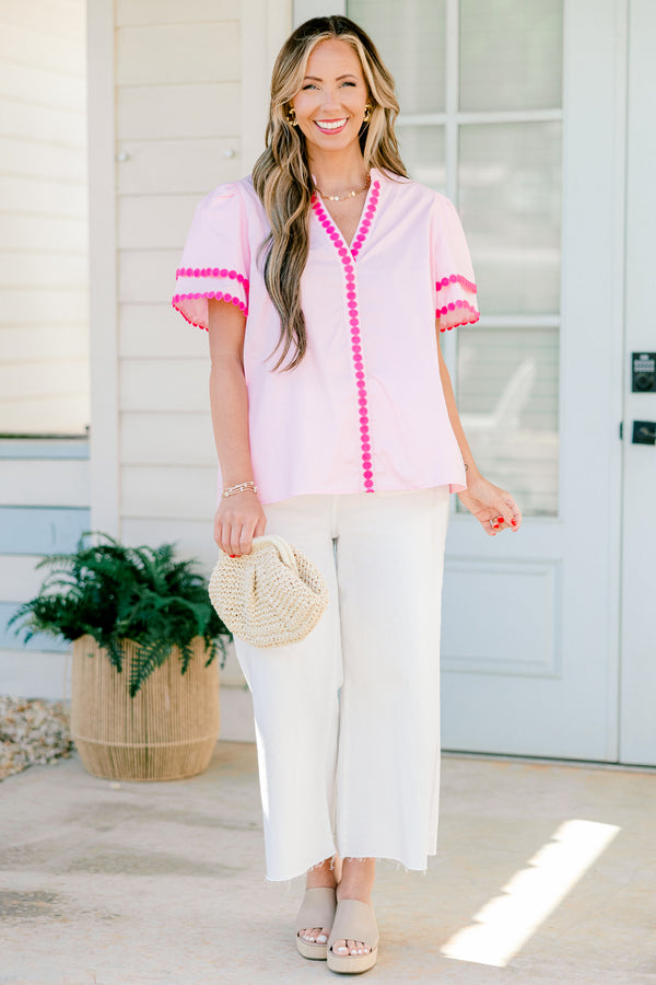 Chic Soul Plus size clothing, pink short sleeve top that has a v-neckline and polka detailing on the sleeves and throughout the neckline 