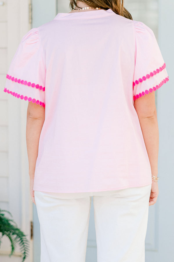 Chic Soul Plus size clothing, pink short sleeve top that has a v-neckline and polka detailing on the sleeves and throughout the neckline 