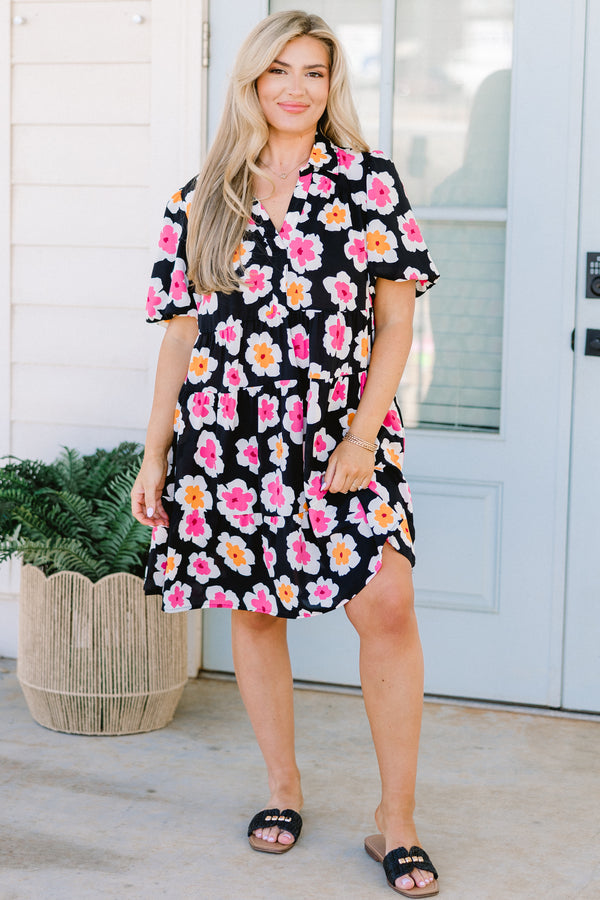 Chic Soul plus size clothing, black short sleeve tiered mini dress with v neckline and puff sleeves with large orange and pink floral pattern