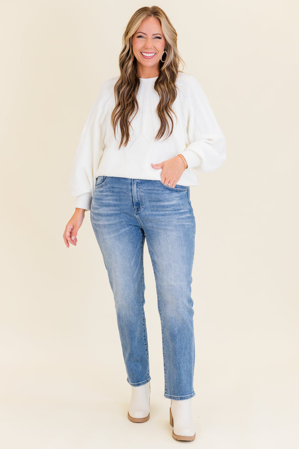 mid-waisted medium-wash straight-leg cropped denim jeans with silver button detailing 
