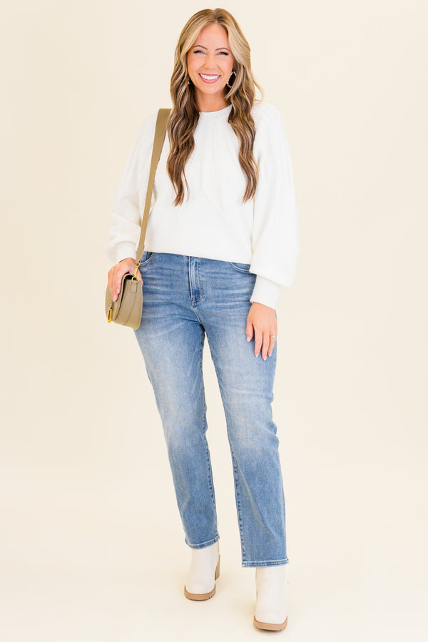 mid-waisted medium-wash straight-leg cropped denim jeans with silver button detailing 
