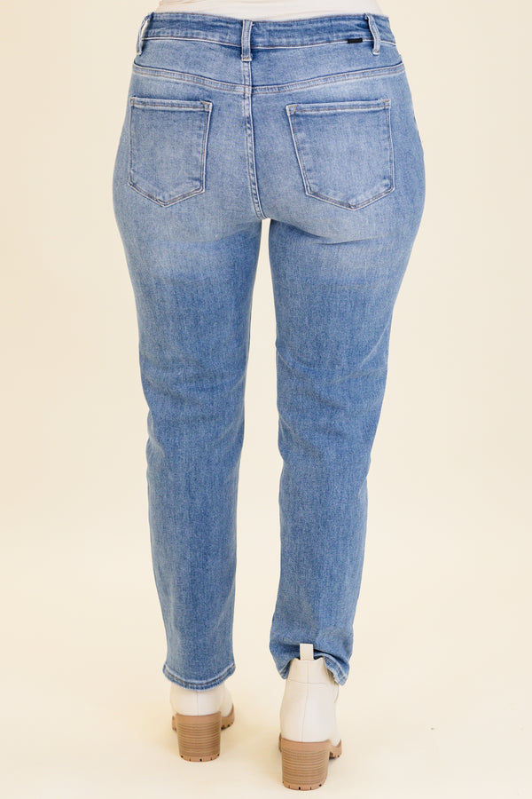mid-waisted medium-wash straight-leg cropped denim jeans with silver button detailing 
