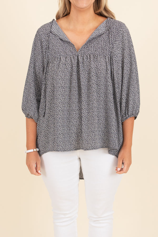 Chic Soul plus size clothing, black top with white pattern and bubble sleeves