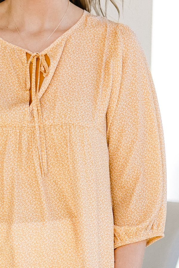 Chic Soul plus size clothing, orange and small white leopard print three-quarter puff sleeve top with string tie neckline