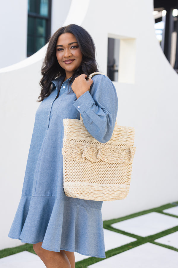Chic Soul plus size clothing, beige woven bag with straps as well as a ruffle flap going around the top middle of the bag 