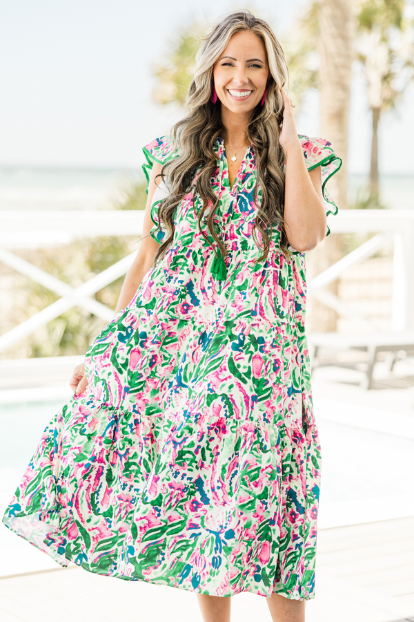 Chic Soul plus size clothing, short-flutter-sleeve green ruffled baby doll midi dress with a split-v-neckline and solid green tassels with a pink and white abstract watercolor floral pattern 