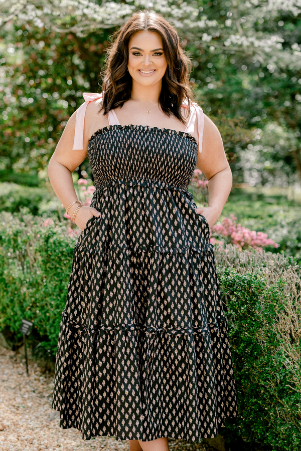 Chic Soul plus size clothing, sleeveless solid white tied bow straps with a black ruffled tiered midi dress with a smocked bodice and a subtle abstract pattern