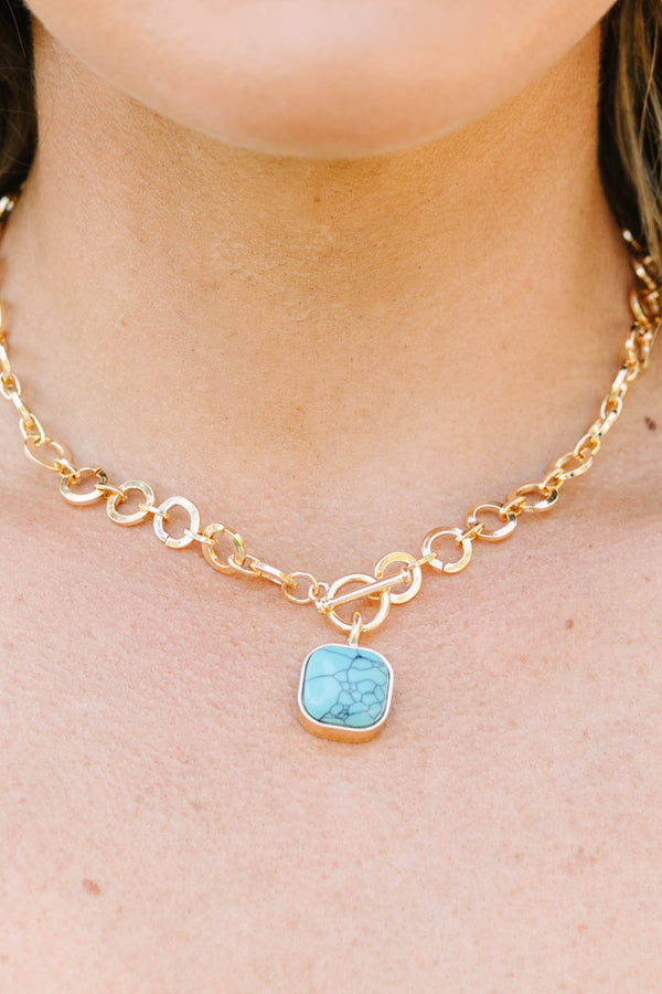 Plus Size gold chain necklace with a square turquoise stone pendant and toggle closure.