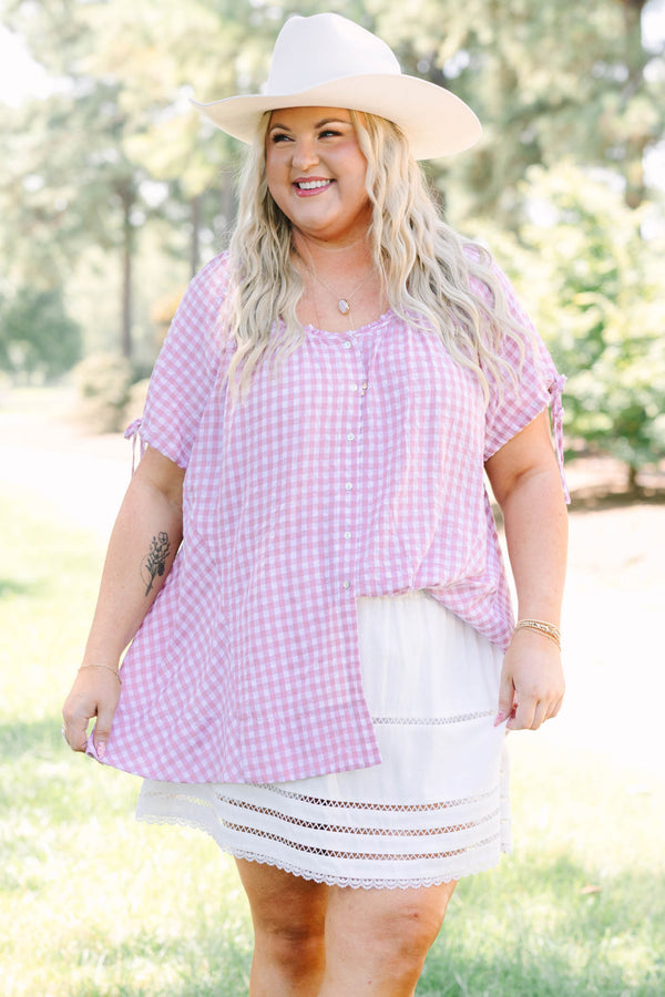 Plus Size pink and white gingham tunic with short tie-sleeves and a button-down front.