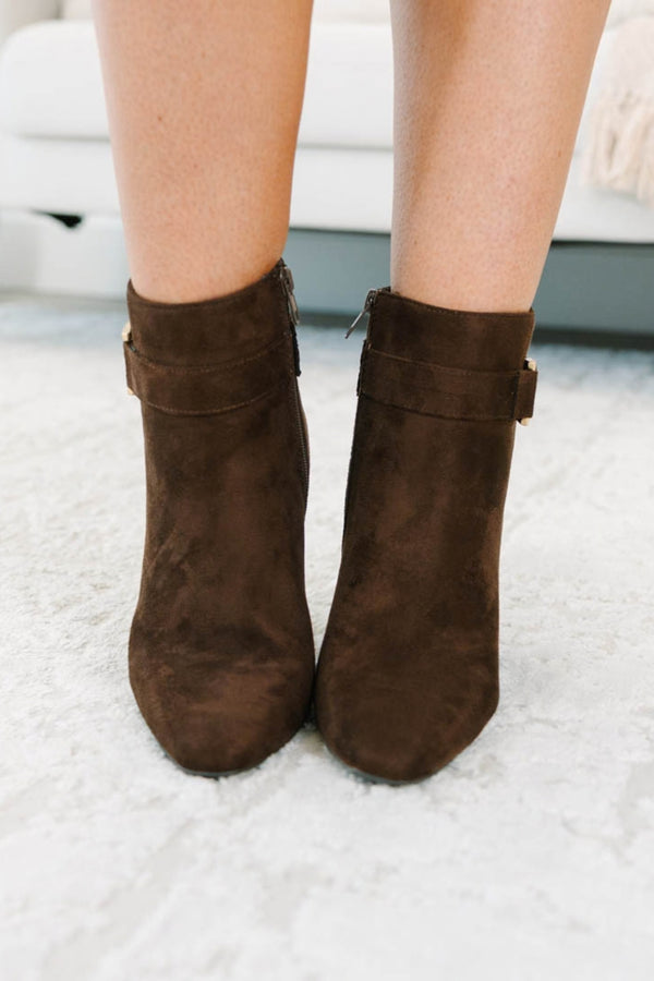 Plus Size brown microsuede ankle booties with a pointed toe and gold-tone buckle accent.