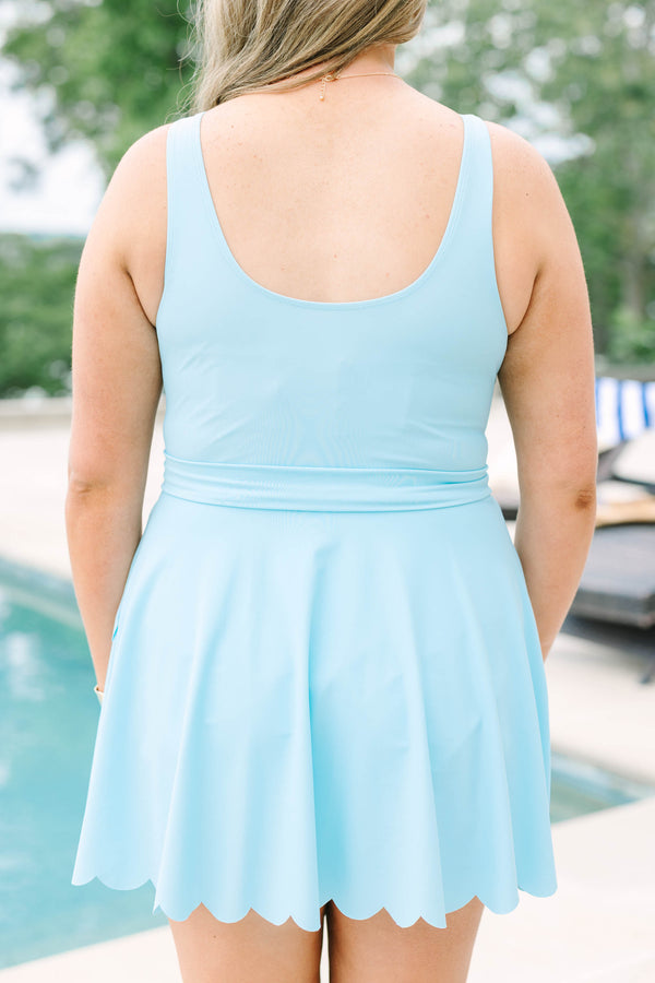 Plus Size light blue swim dress with scalloped neckline and hem, featuring a bow-tied waist belt.