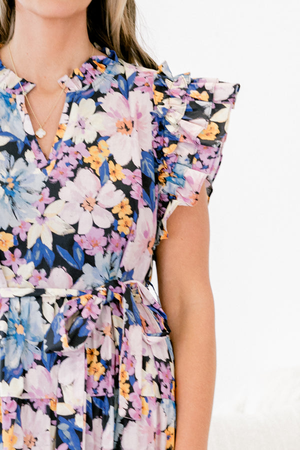 Plus Size navy floral tiered maxi dress with flutter sleeves, a split v-neck, and a waist sash.