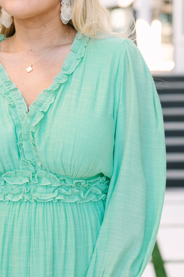 Chic soul plus size clothing, turquoise maxi dress with long bubble sleeves that have ruffle detailing along the bottom of each sleeve as well as ruffles at the bottom of each tier going around the waistband going along and down the v-neckline 