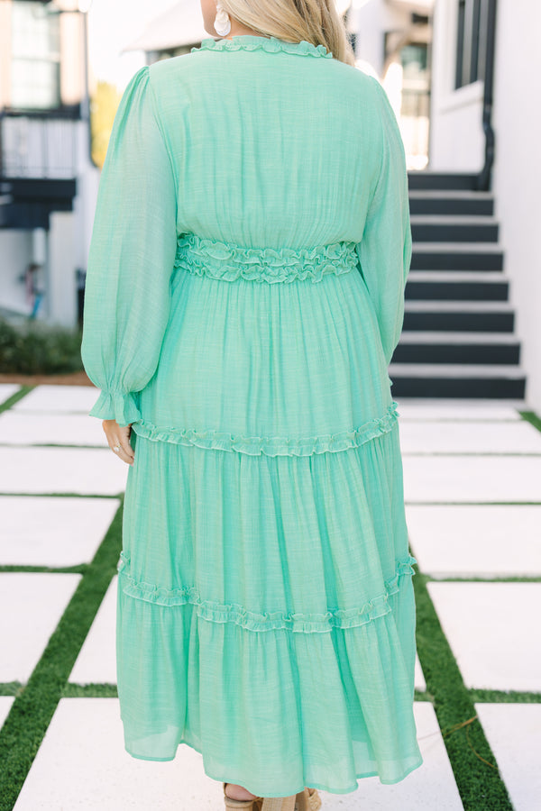 Chic soul plus size clothing, turquoise maxi dress with long bubble sleeves that have ruffle detailing along the bottom of each sleeve as well as ruffles at the bottom of each tier going around the waistband going along and down the v-neckline 