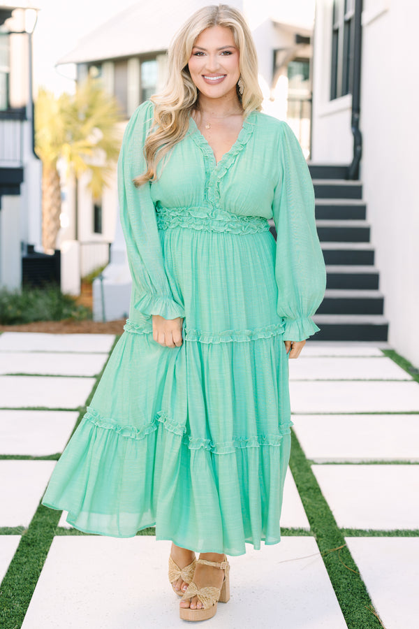 Chic soul plus size clothing, turquoise maxi dress with long bubble sleeves that have ruffle detailing along the bottom of each sleeve as well as ruffles at the bottom of each tier going around the waistband going along and down the v-neckline 