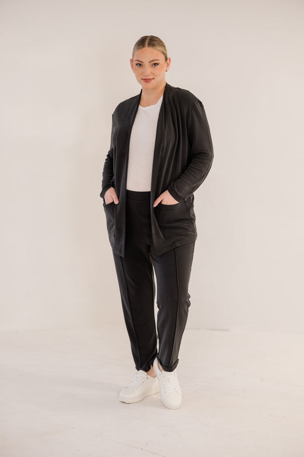 Chic Soul plus size clothing, black long sleeve minimal flowy cardigan with side pockets in the front