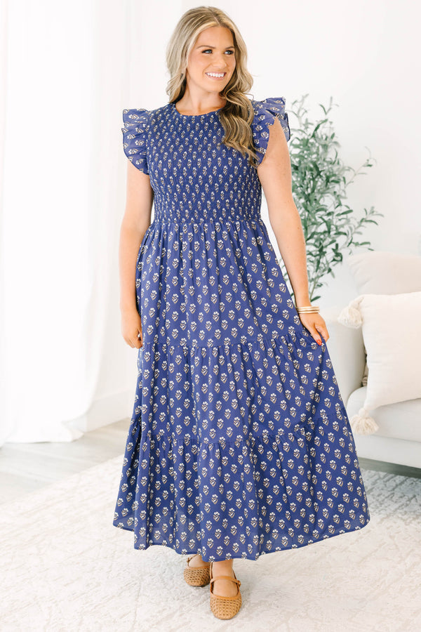 Plus Size navy tiered maxi dress with a smocked bodice, flutter sleeves, and a floral print.