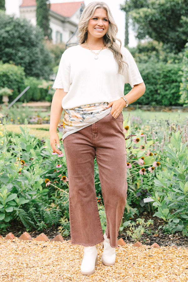 Plus Size high-waisted boot cut jeans in rum brown with a frayed hem and acid-wash finish.