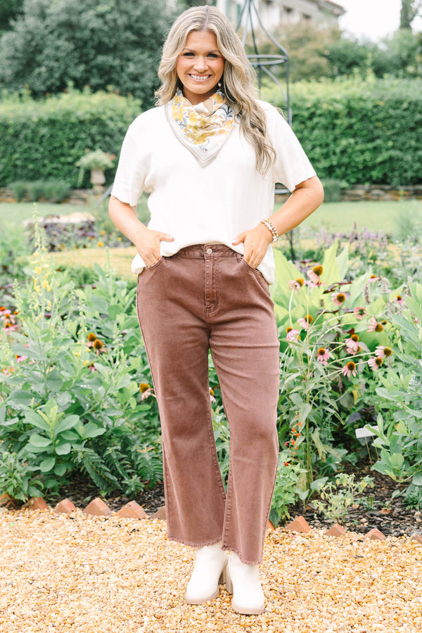 Plus Size high-waisted boot cut jeans in rum brown with a frayed hem and acid-wash finish.