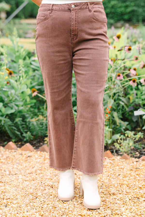 Plus Size high-waisted boot cut jeans in rum brown with a frayed hem and acid-wash finish.