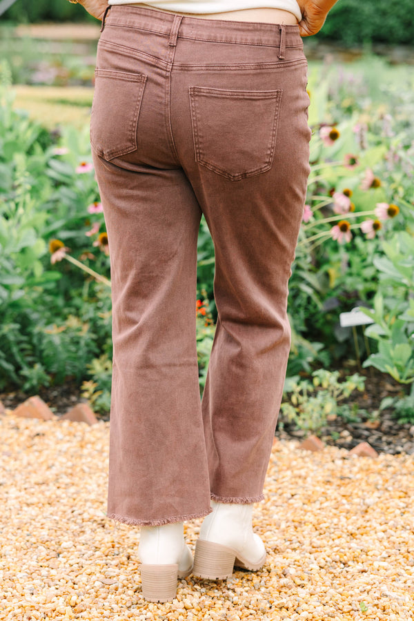 Plus Size high-waisted boot cut jeans in rum brown with a frayed hem and acid-wash finish.
