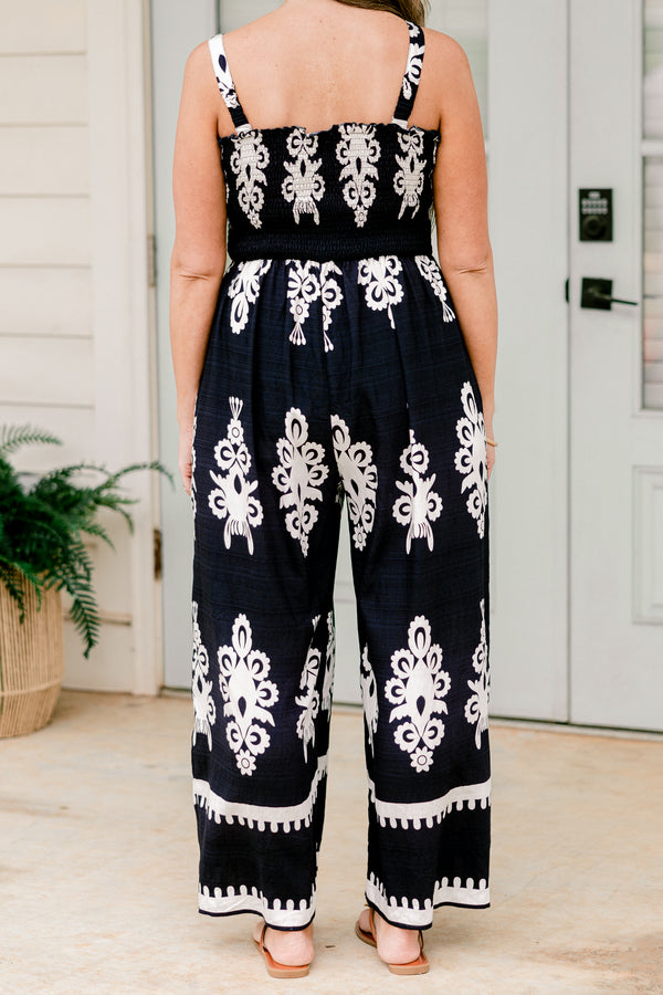 Chic Soul plus size clothing, sleeveless spaghetti strap navy wide leg jumpsuit with a white paisley pattern 