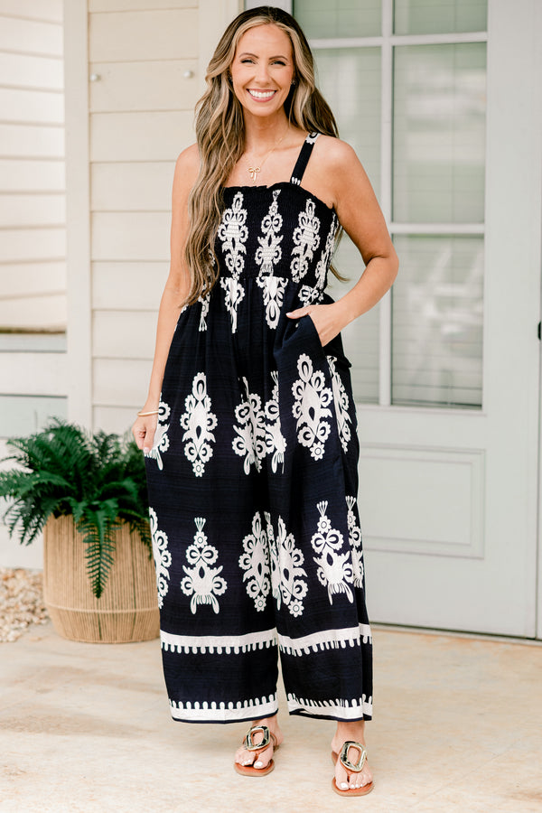 Chic Soul plus size clothing, sleeveless spaghetti strap navy wide leg jumpsuit with a white paisley pattern 