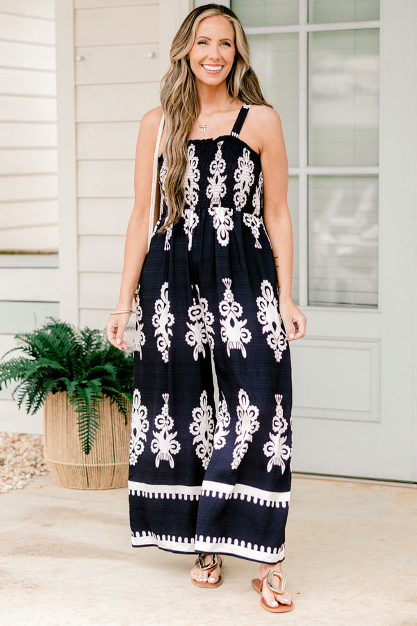 Chic Soul plus size clothing, sleeveless spaghetti strap navy wide leg jumpsuit with a white paisley pattern 