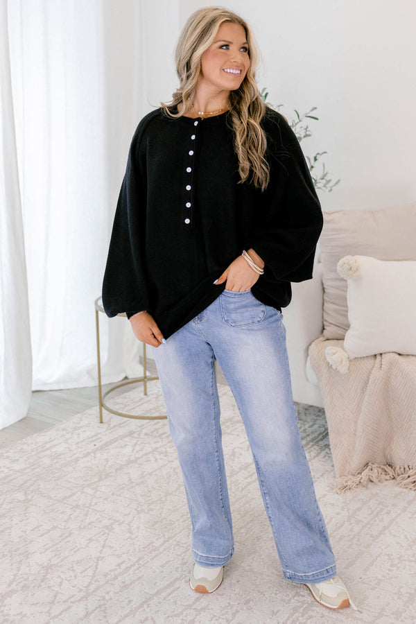 Chic Soul plus size clothing, black sweater with long bubble sleeves and white buttons going down to the chest area 