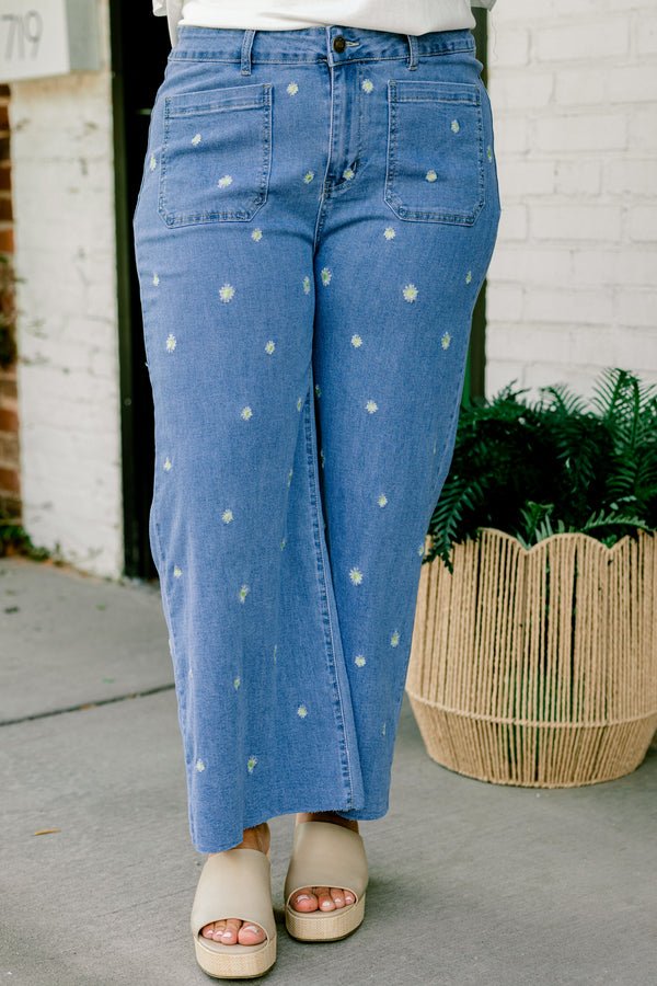 Chic Soul plus size clothing, medium wash wide leg denim jeans with two front pockets with small white embroidered flowers