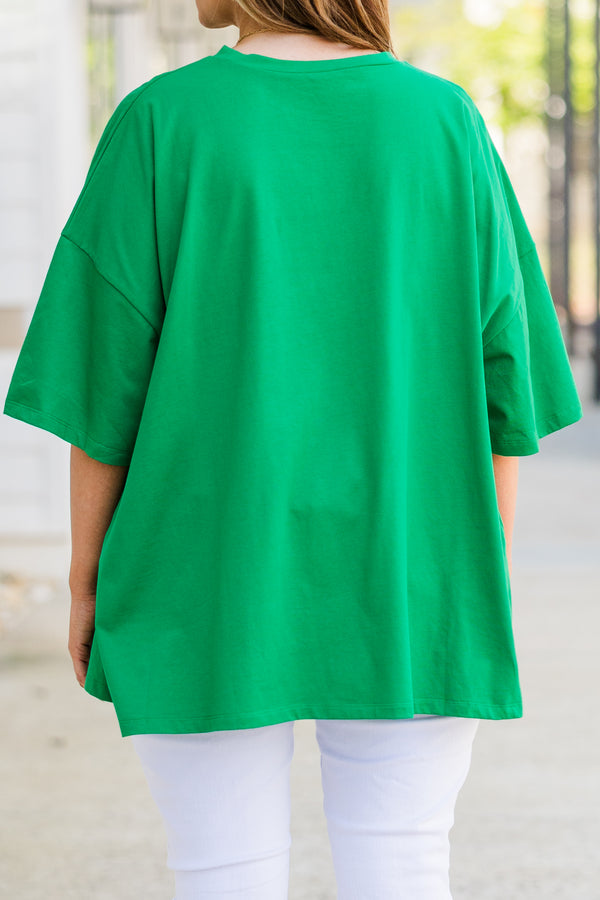Plus Size oversized evergreen boyfriend tee with a pink lightning bolt smiley face graphic.