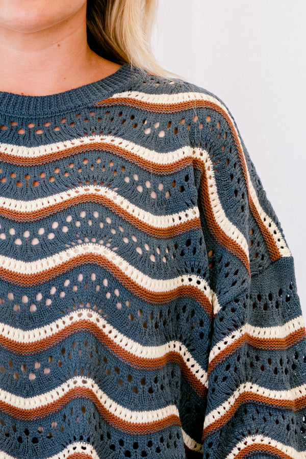 Chic Soul plus size clothing, navy long sleeve sweater with brown and white wavey stripes going across the sweater 