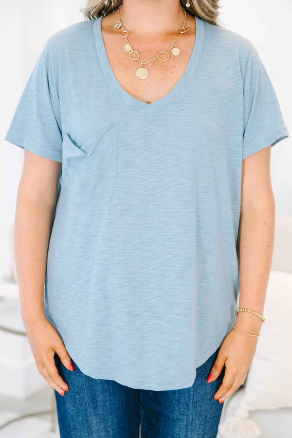 Plus Size dusty blue v-neck top with a relaxed fit, short sleeves, and a front chest pocket.