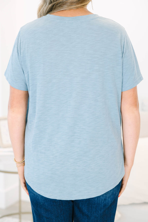 Plus Size dusty blue v-neck top with a relaxed fit, short sleeves, and a front chest pocket.