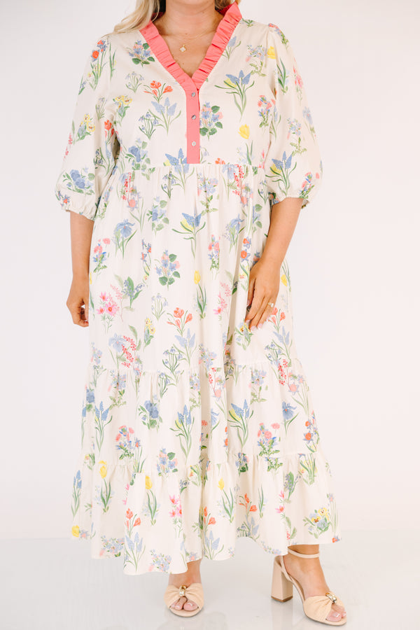 Chic Soul plus size clothing, cream maxi dress with half bubble sleeves along with a pink strip ruffle detail going along the v-neckline and a multi-colored floral pattern throughout