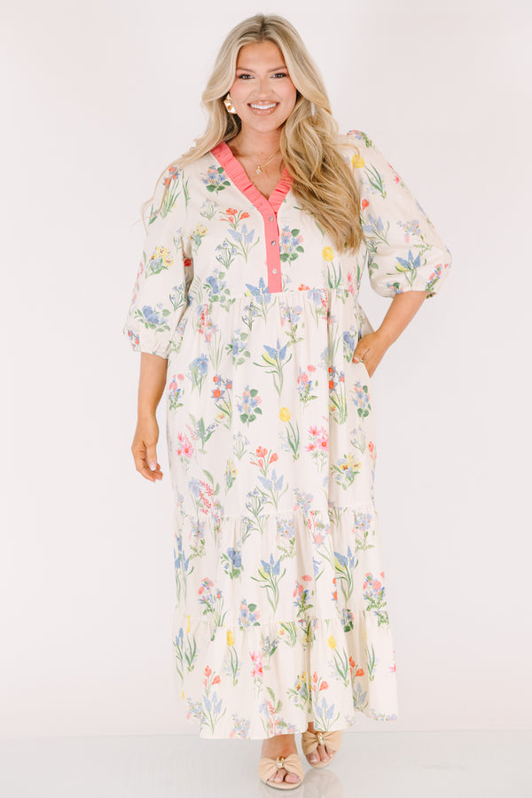 Chic Soul plus size clothing, cream maxi dress with half bubble sleeves along with a pink strip ruffle detail going along the v-neckline and a multi-colored floral pattern throughout
