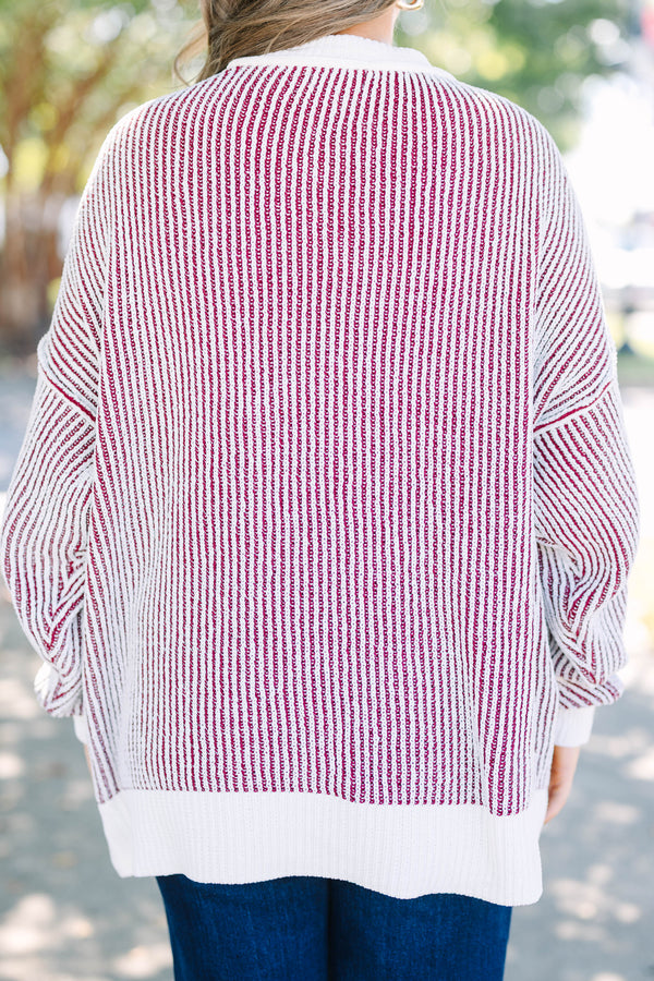 Plus Size cabernet and white striped knit sweater with a crew neckline and ribbed trim.