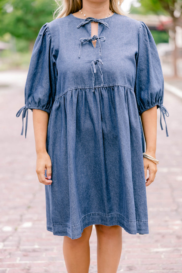 Chic Soul plus size clothing, denim blue short-sleeve short dress that has sleeves tied with bows and a bow tied detailing on the top