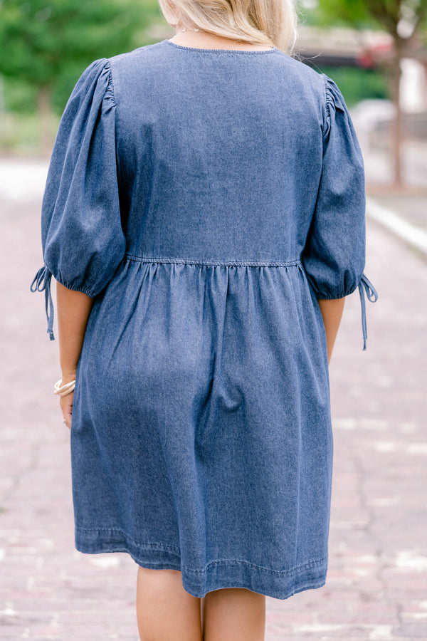 Chic Soul plus size clothing, denim blue short-sleeve short dress that has sleeves tied with bows and a bow tied detailing on the top