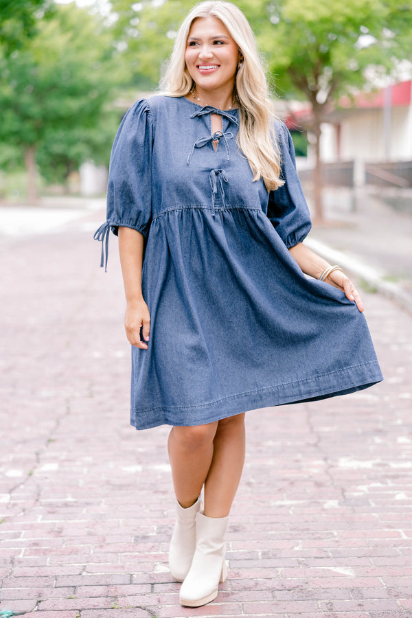 Chic Soul plus size clothing, denim blue short-sleeve short dress that has sleeves tied with bows and a bow tied detailing on the top