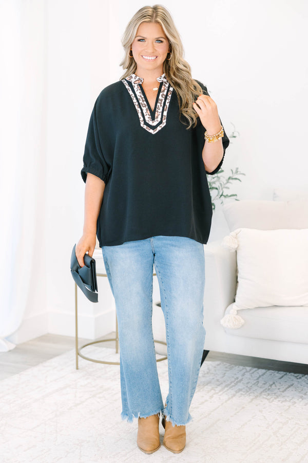 Plus Size black short dolman sleeve top with a leopard print split v-neckline trim.