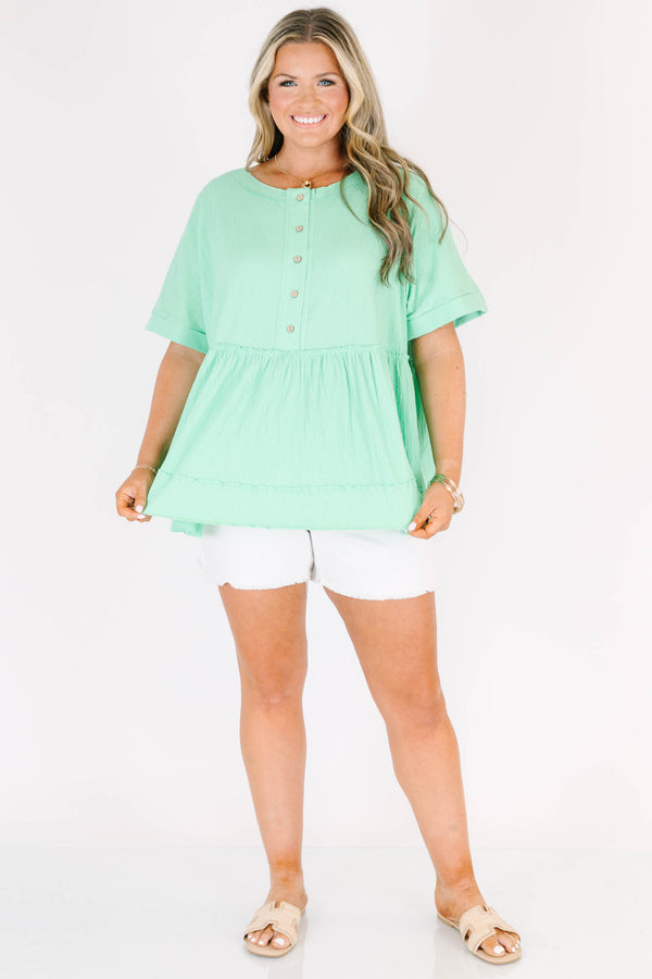 Chic Soul plus size clothing, short-sleeve vibrant green baby doll top with a high-scoop-neckline and brown button detailing with subtle distressed detailing 