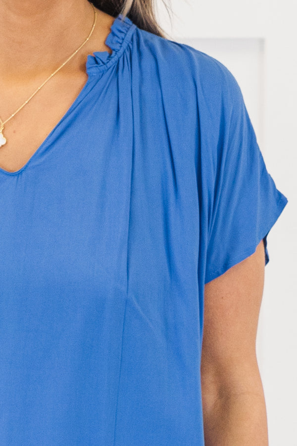 Chic Soul plus size clothing, short-sleeve denim blue top with a v-neckline and ruffled detailing along the collar 