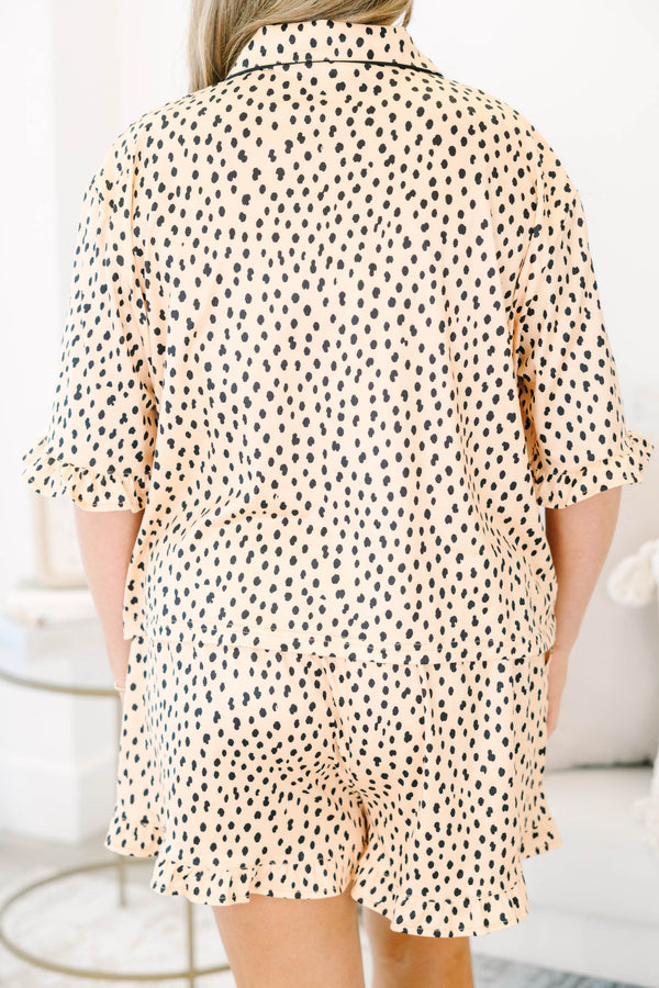Plus Size cheetah print pajama set with short sleeves, black piping, and ruffled hem shorts.