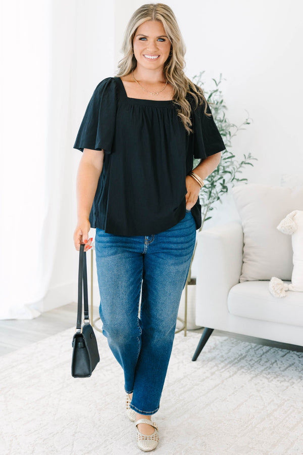 Plus size black cotton top with breezy bell sleeves and a modern square neckline.