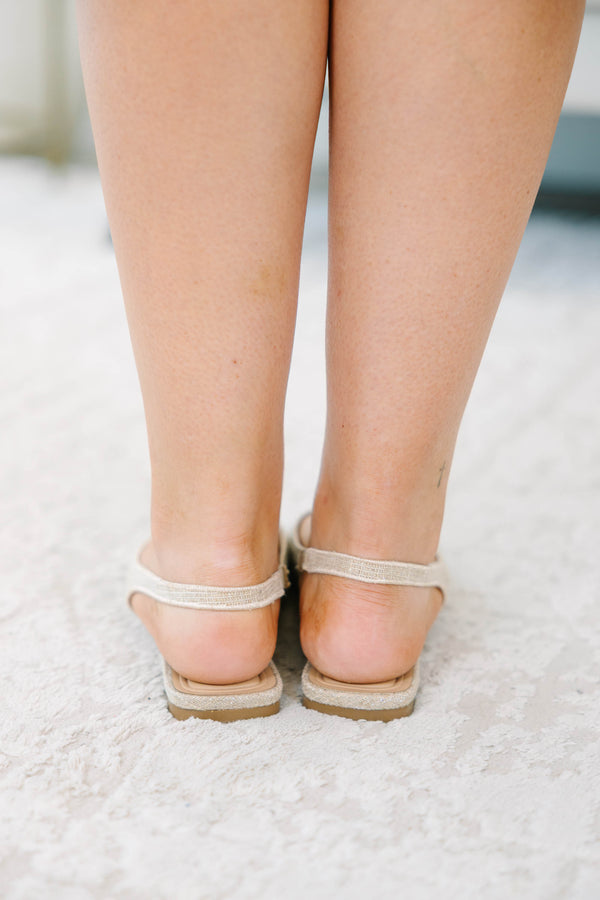 Natural pointed-toe slingback flats with delicate eyelet embroidery and a comfortable low heel.