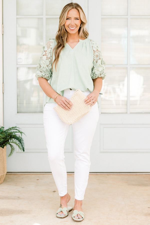 Chic Soul plus size clothing, high-waisted white skinny jeans with a silver button detailing 
