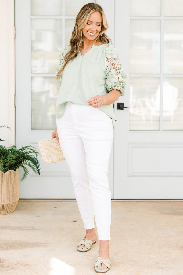 Chic Soul plus size clothing, high-waisted white skinny jeans with a silver button detailing 