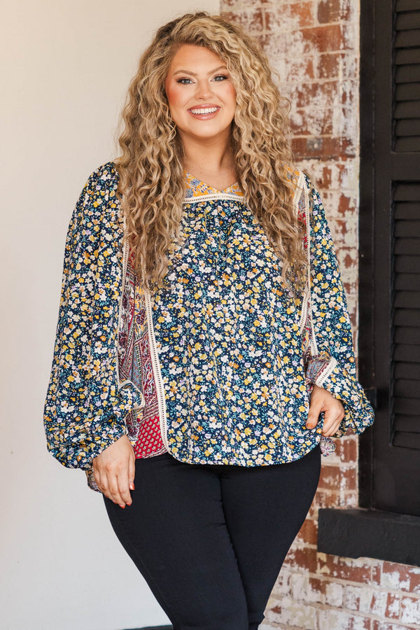 Chic Soul plus size clothing, navy colored base long sleeve top with multi prints orange florals and red bandana style pattern at inner sides of sleeves and orange colored around neckline and lace bodice structure